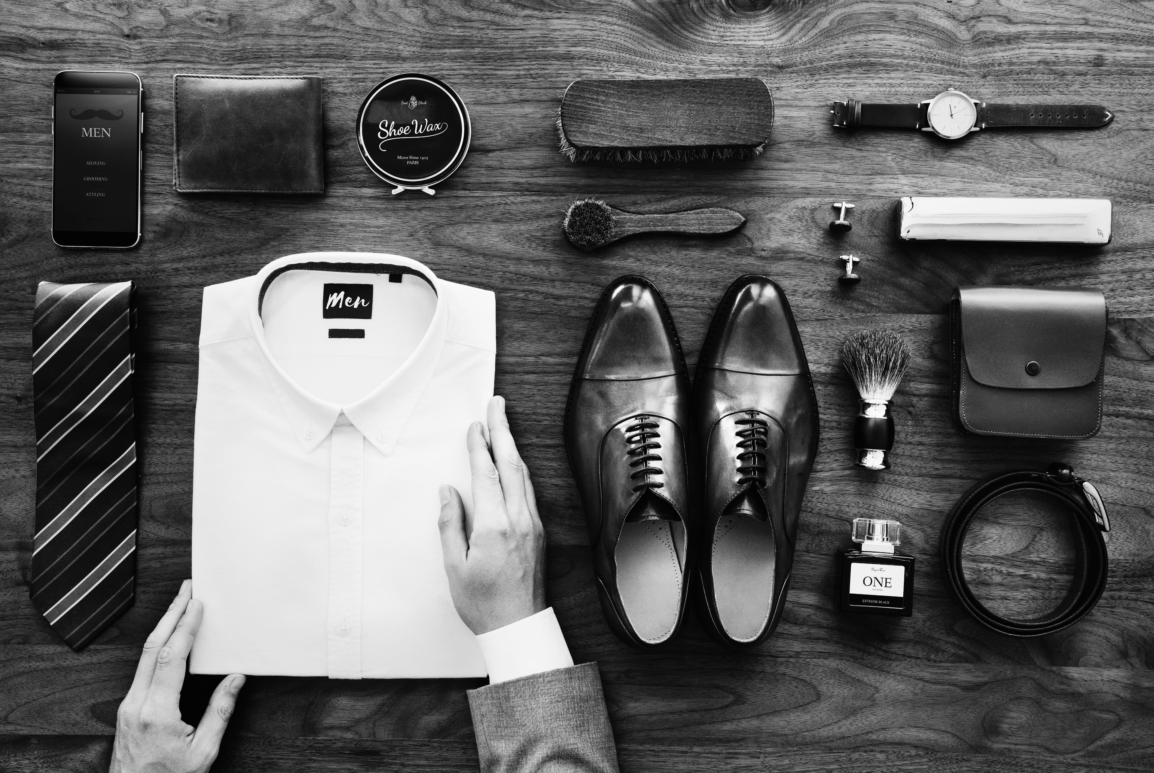 A woman showcasing formal suits at a clothing store